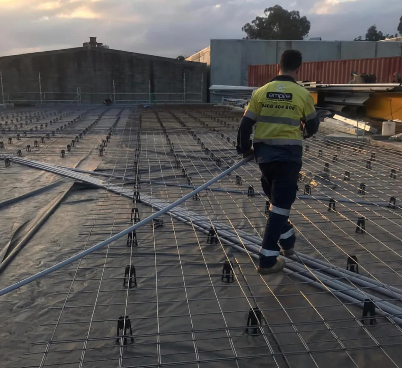 Empire electrician pulling cable across a commercial slab in Sydney
