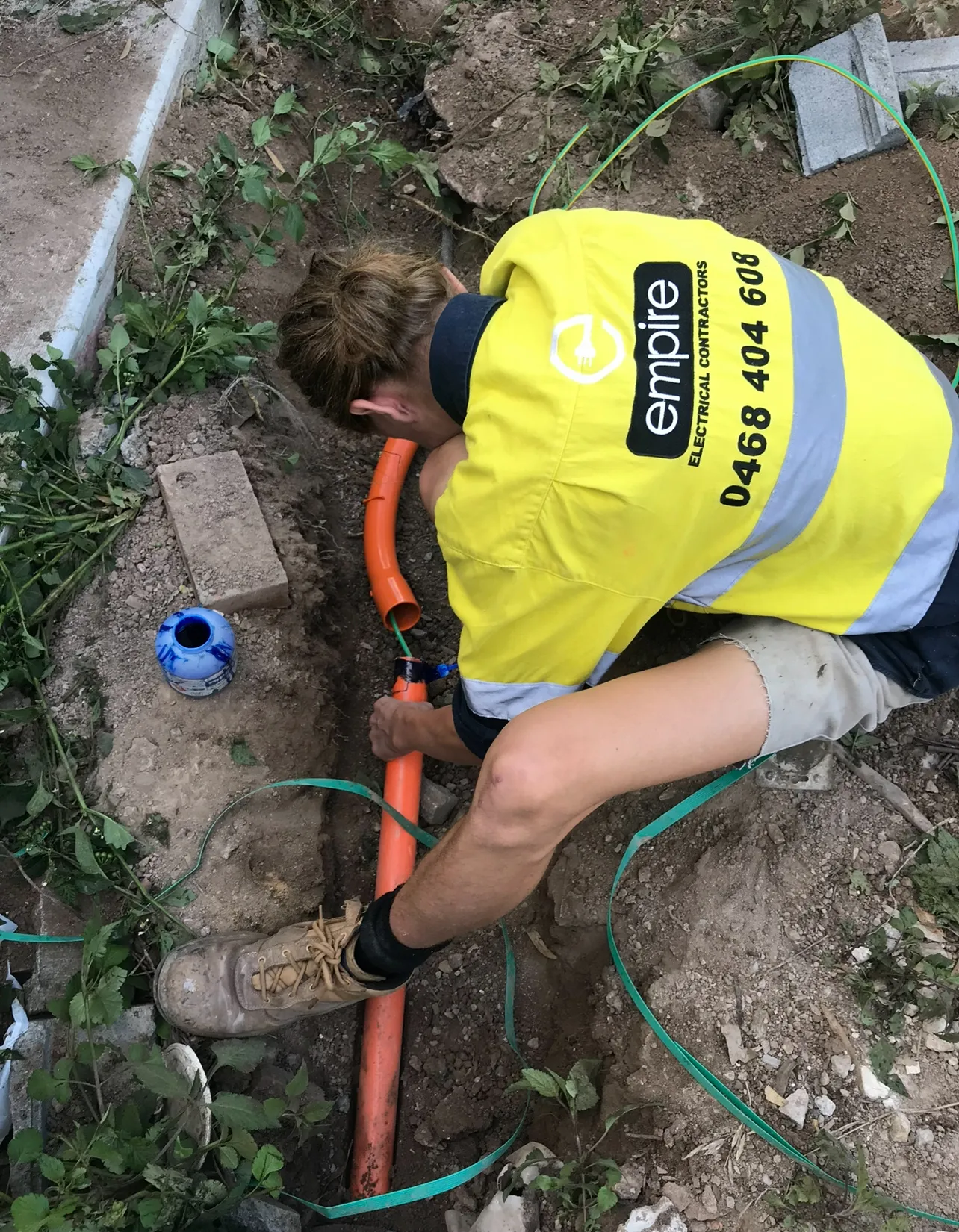 Empire electrician laying underground electrical conduit in Sydney