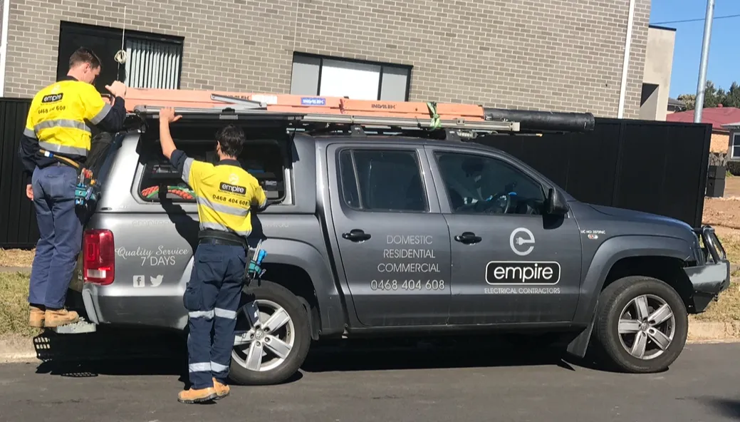 Empire electricians loading equipment on a Sydney service vehicle
